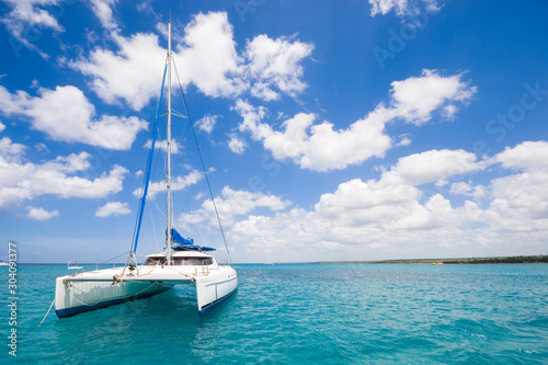 Luxury yacht anchored on turquoise water of Caribbean Sea, Dominican Republic Fototapeta