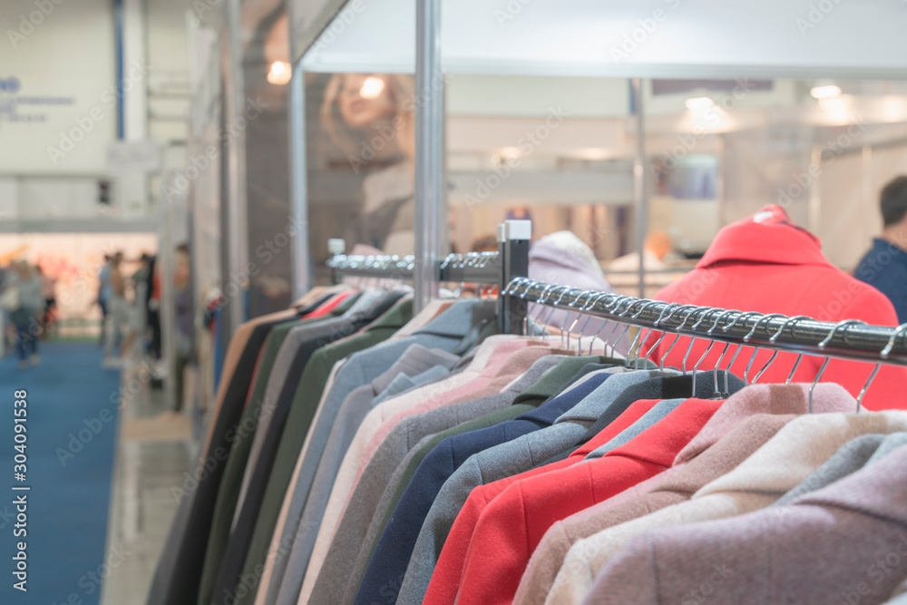 Warm and stylish women's coats are for sale in the shopping mall