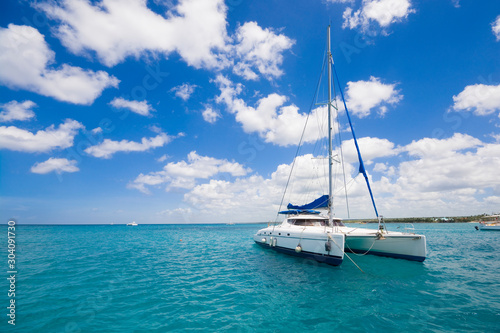 Luxury yacht anchored on turquoise water of Caribbean Sea, Dominican Republic © Mariusz Świtulski