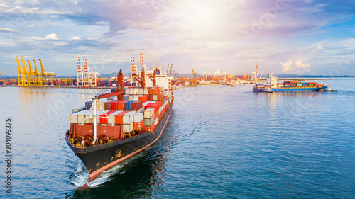 Container ship carrying container for business freight shipping import and export, Aerial view container ship arriving in commercial port.
