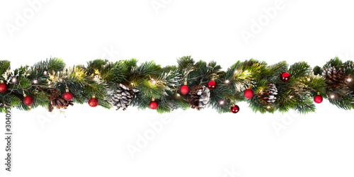 Christmas tree garland decorated with red baubles and shiny lights, festive concept banner
