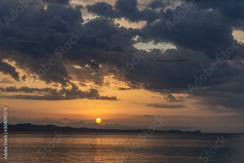 Beautiful dramatic sunrise sea beach landscape. Horiozntal color photography. 