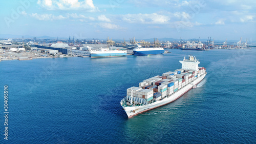 Aerial of white cargo ship carrying container and running for export and import goods  from  cargo yard port to other ocean concept freight shipping ship on blue sea background, webinar banner