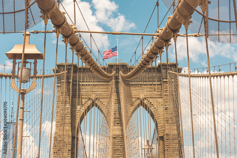 Fototapeta premium Brooklyn Bridge with the USA Flag