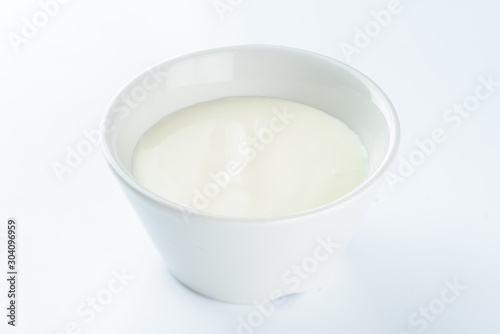 mayonnaise in a bowl on a light background