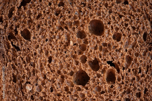 Close up black bread texture. Macro photography. 