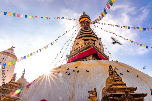 Swayambhunath Stupa, aka The Monkey Temple, during sunrise in Kathmandu, Nepal. A UNESCO Heritage Site. Ancient ruins and stone temples.