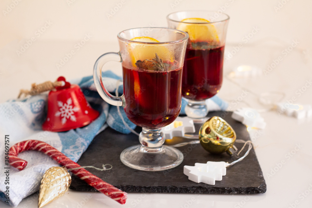 mulled wine of red wine and spices and Christmas decorations on a white background mulled wine of red wine and spices and Christmas decorations on a white background