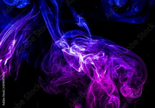 Colored smoke on black background