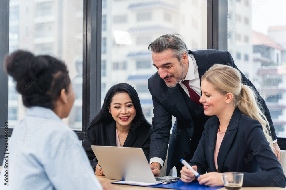 Corporate business team and manager in a meeting.Young team of coworkers making great business discussion in modern coworking office.Teamwork people concept