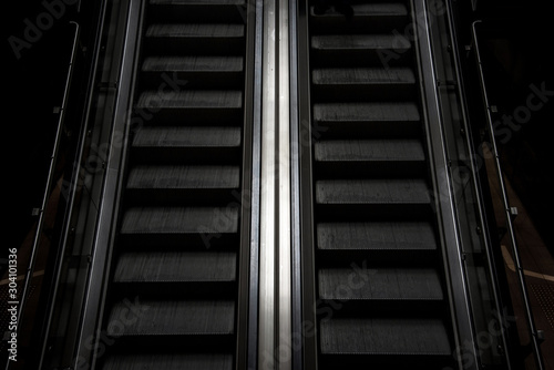 Abstract image of an escalator in the subway as a symbol of moving forward, getting out of depression, advancing and achieving life goals
