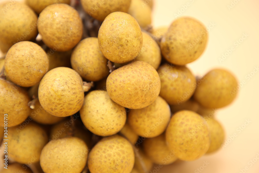 longan fresh fruit of Thailand on yellow background longan fresh fruit of Thailand on yellow background
