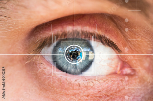 Eye monitoring and treatment in healthcare. Biometric scan of male eye closeup.