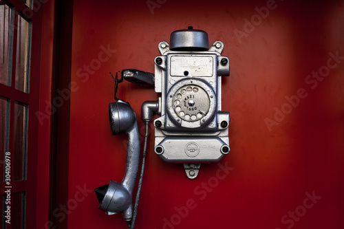 Street phone box. Old dirty and scratched telephone booth
