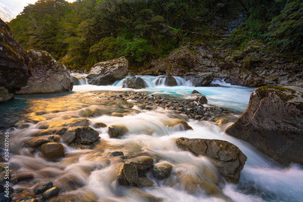 Beautiful scenic view long exposure of Falls Creek Water Fall along Milford Sound Highway road, Fiordland National Park 9679, New Zealand. Beautiful scenic view long exposure of Falls Creek Water Fall along Milford Sound Highway road, Fiordland National Park 9679, New Zealand.