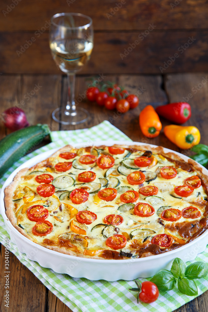Quiche with tomatoes, spinach and feta cheese