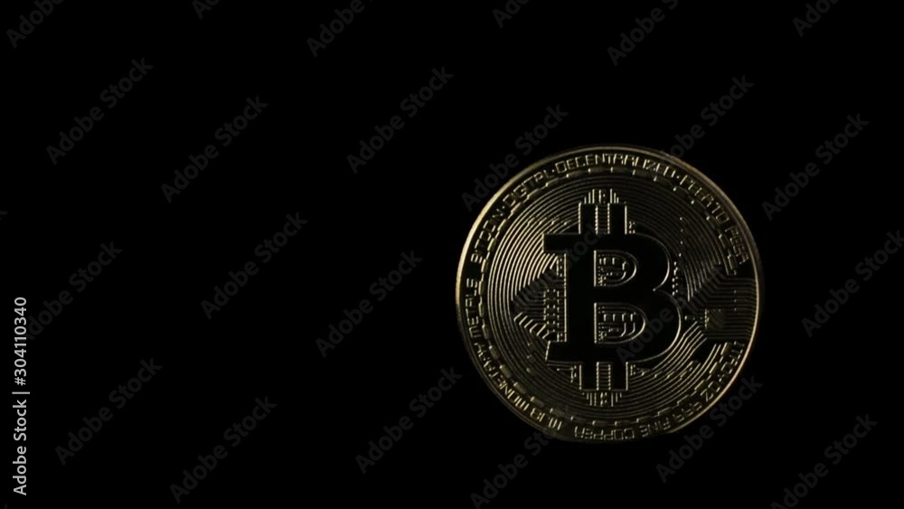 Light moving on a bit coin crypto currency on a black background Light moving on a bit coin crypto currency on a black background