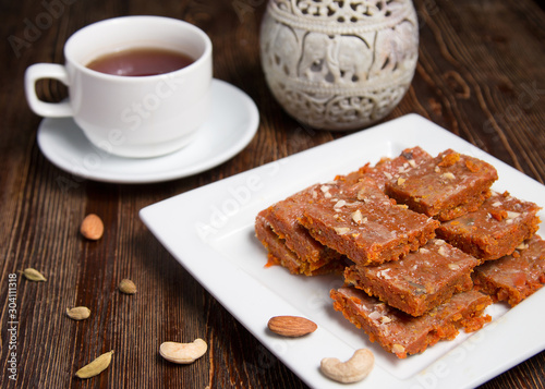 Gajar halva with nuts. National Indian dessert. Gajar halva in a plate close-up.