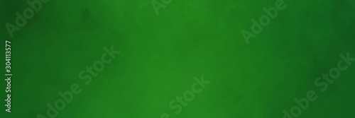 vintage abstract painted background with forest green, very dark green and green colors and space for text or image. can be used as header or banner