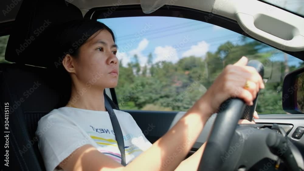 Woman driving a car with pleasure Woman driving a car with pleasure