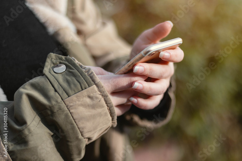 Woman holding a phone in the hands