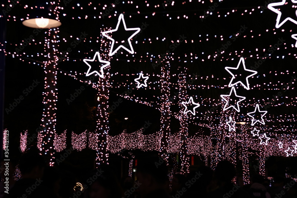 Naklejka premium The street was decorated with light in christmas in New Taipei City, Taiwan. Blurred view.