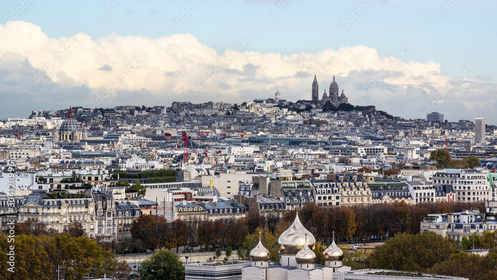 Aerial photo of Montmartre with Sacre Coeur Basilica against clouds