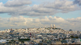 Aerial photo of Montmartre with Sacre Coeur Basilica against clouds