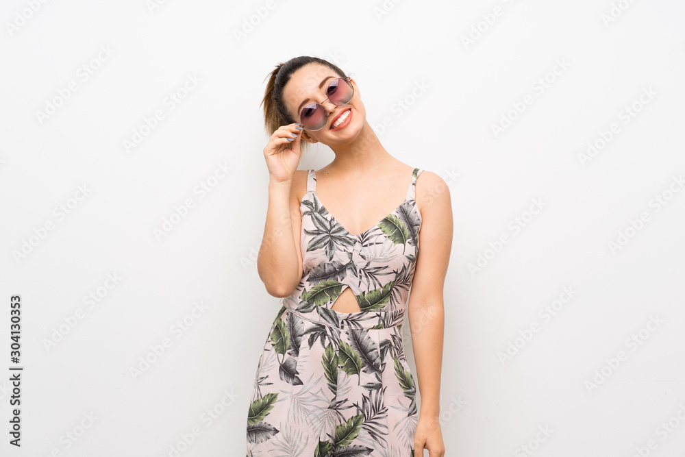 Young woman over isolated white background with glasses and happy Young woman over isolated white background with glasses and happy