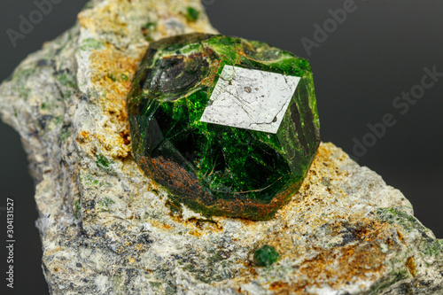 macro mineral stone Andradite on a black background photo