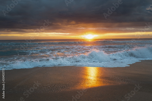 colorful sunrise on surf in Delray Beach Florida