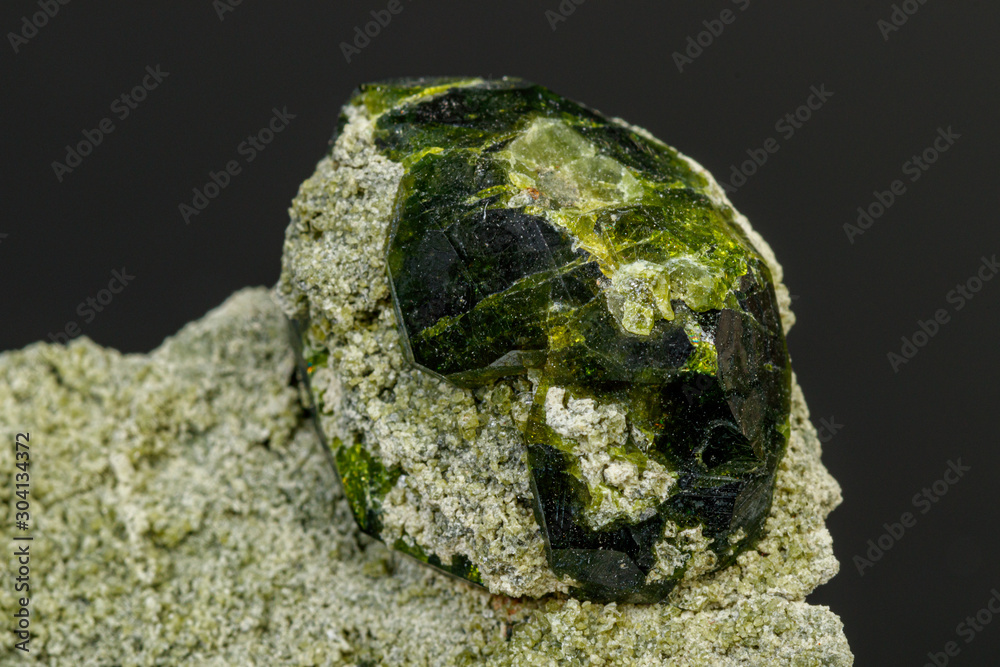 macro mineral stone Andradite on a black background macro mineral stone Andradite on a black background