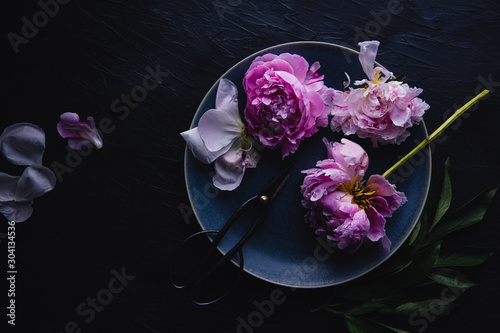 Wallpaper Mural Overhead view of peony flowers and scissors on plate Torontodigital.ca