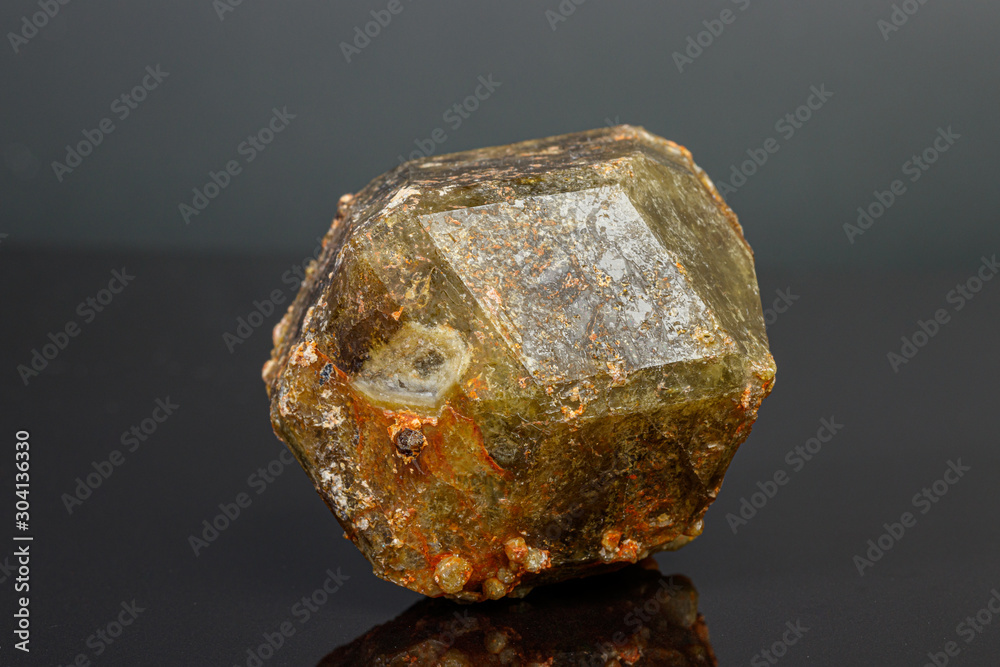 macro mineral stone Andradite on a black background