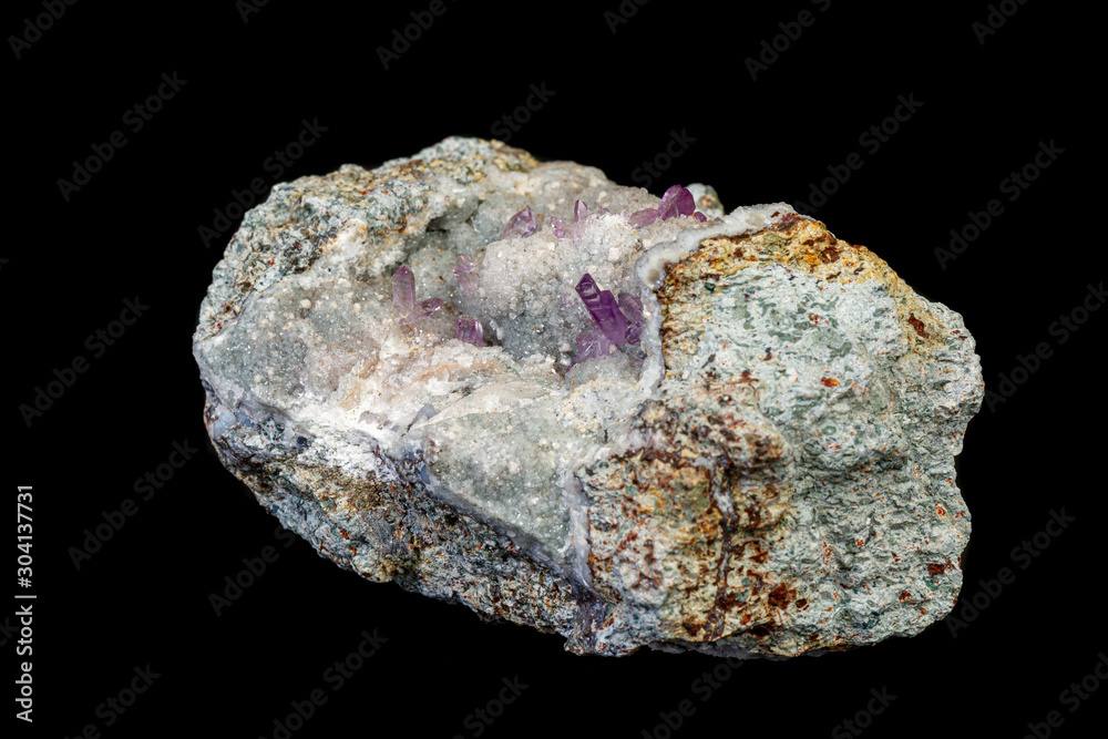 macro mineral amethyst stone in rock on a black background macro mineral amethyst stone in rock on a black background