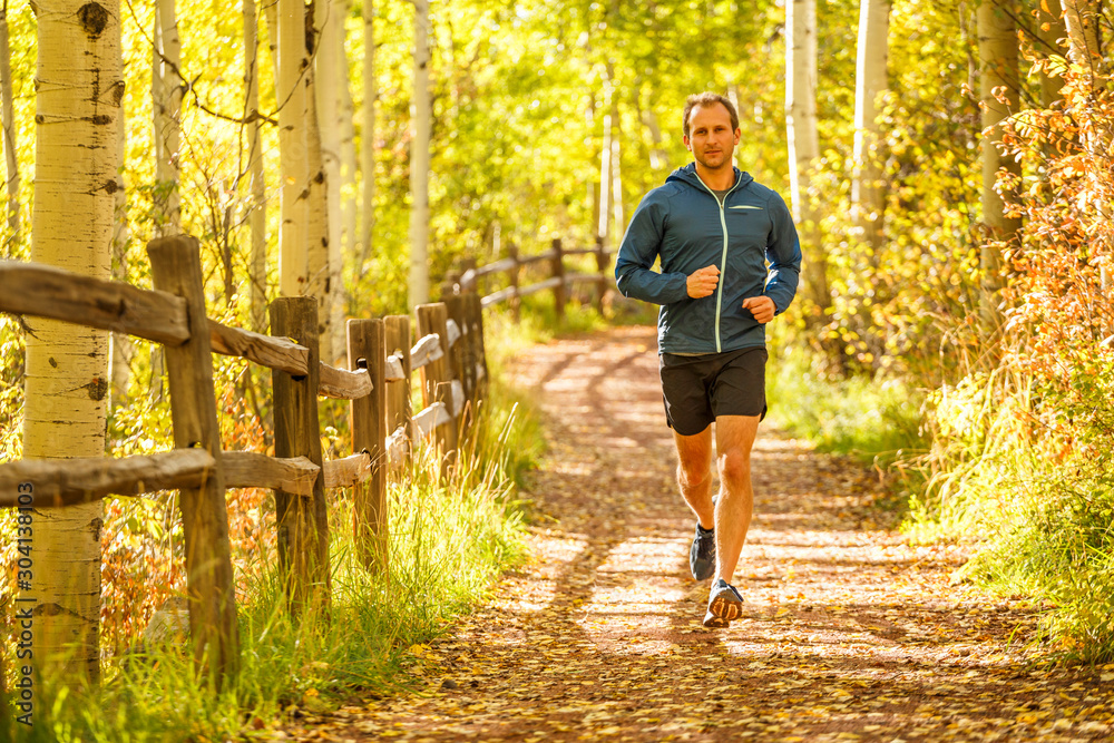 © Tandem Stock - Telluride, Colorado, USA: A male runner jogging along a trail on a sunny autumn day. © Tandem Stock - Telluride, Colorado, USA: A male runner jogging along a trail on a sunny autumn day.