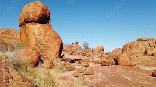 Sunrays at sunset light in Karlu Karlu - Devils Marbles Conservation Reserve. Australian Outback landscape in Northern Territory, Australia near Tennant Creek. Aboriginal land in Red Centre. photo