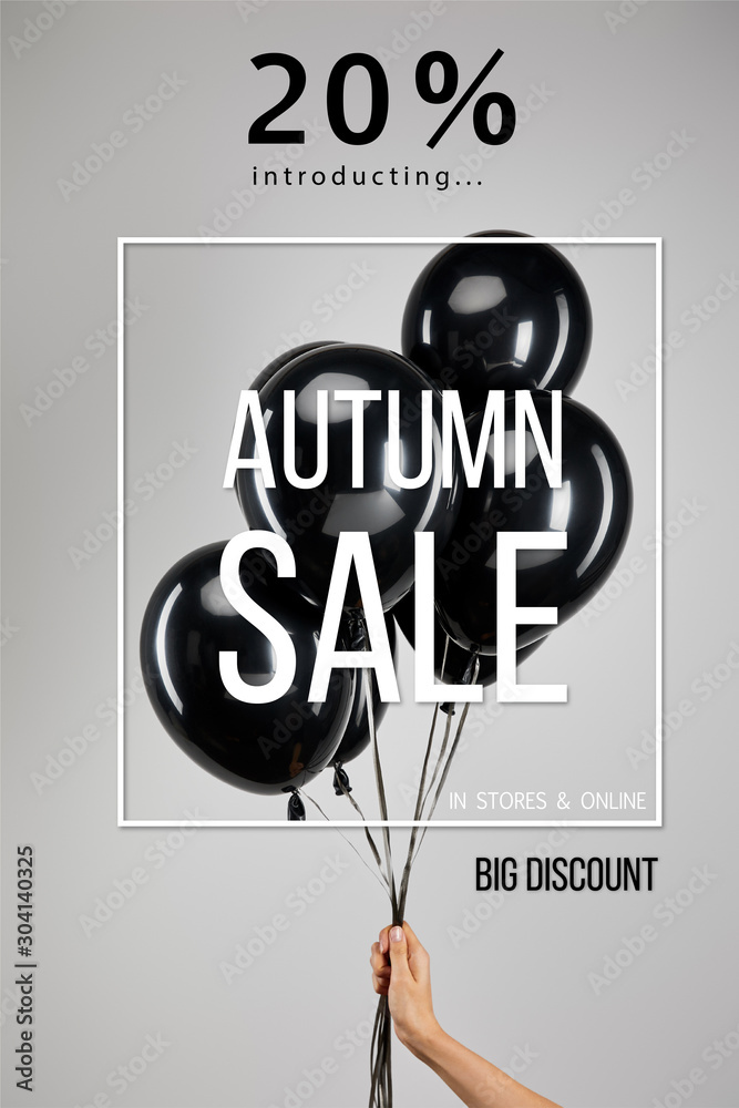 Φωτογραφία partial view of woman holding bunch of black balloons isolated on grey with 20 p