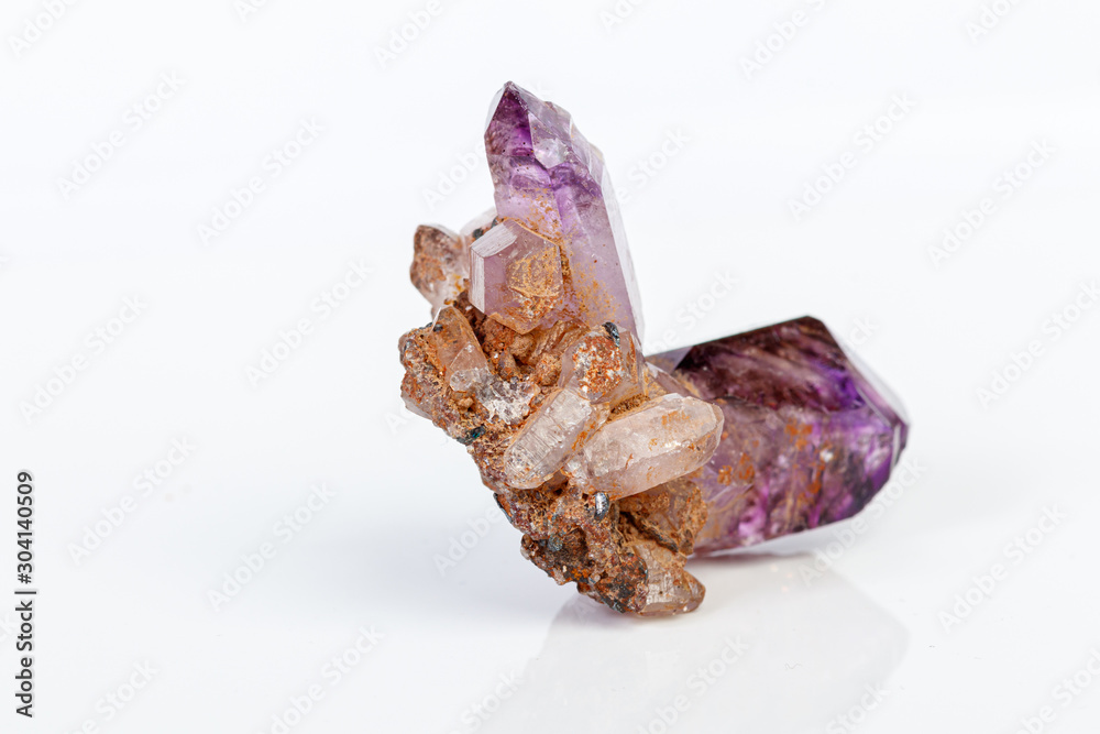macro mineral stone Amethyst on smoky quartz on a white background macro mineral stone Amethyst on smoky quartz on a white background