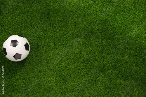 Soccer ball on the green field. View from above. flat lay.Copy space.