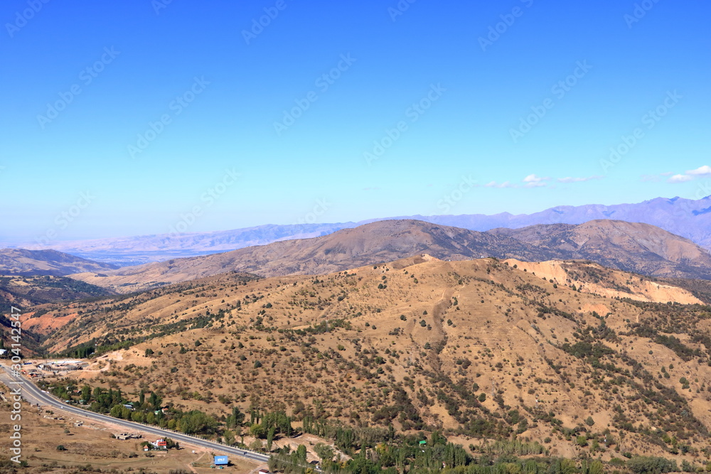 Scenic landscape of Tian Shan mountain range near Chimgan in Uzbekistan