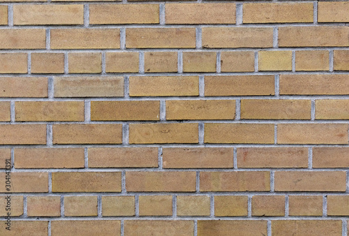 Yellow brick wall closeup texture