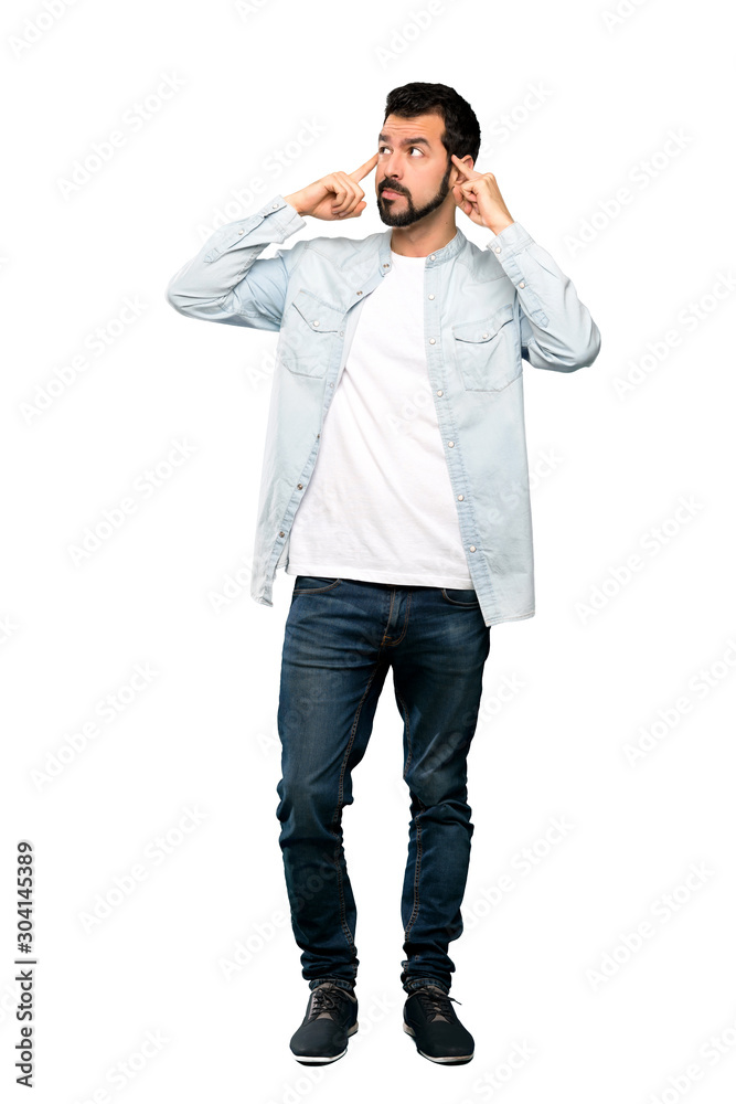 Full-length shot of Handsome man with beard having doubts and thinking over isolated white background Full-length shot of Handsome man with beard having doubts and thinking over isolated white background