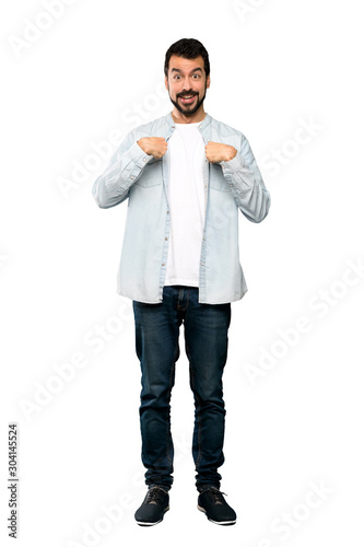Full-length shot of Handsome man with beard with surprise facial expression over isolated white background © luismolinero