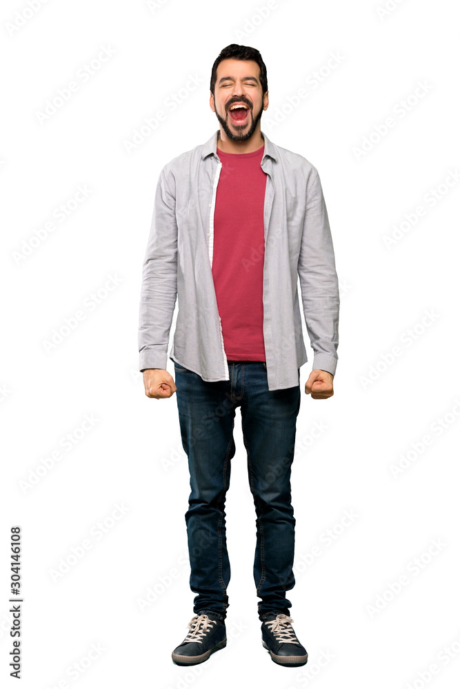 Full-length shot of Handsome man with beard shouting to the front with mouth wide open over isolated white background Full-length shot of Handsome man with beard shouting to the front with mouth wide open over isolated white background