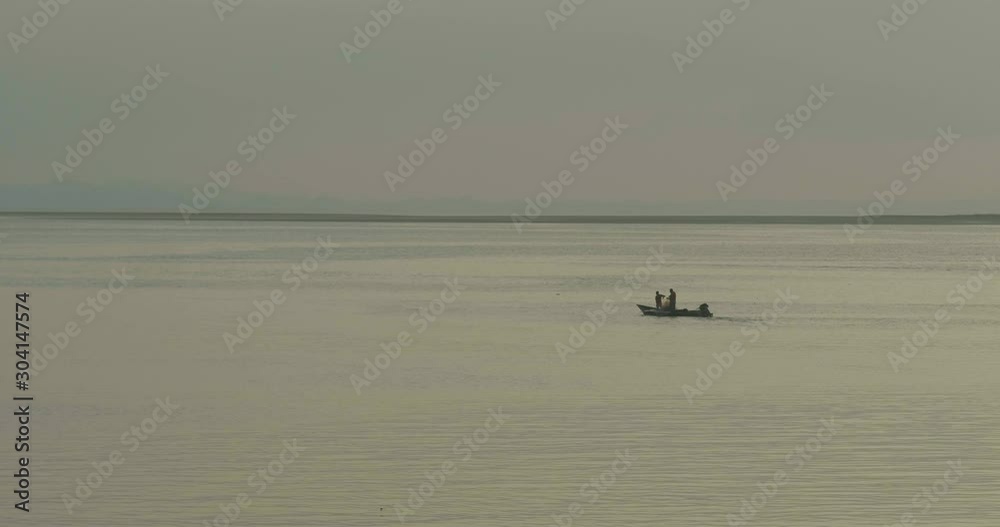 Close Shot of Fishermen Throwing a Net to Start their Trade. Close Shot of Fishermen Throwing a Net to Start their Trade.