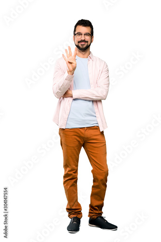 Full-length shot of Handsome man with beard happy and counting four with fingers over isolated white background