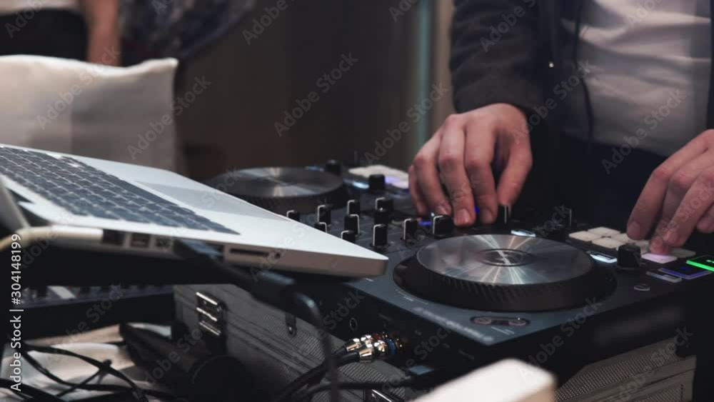 Hands of DJ mix tracks on digital turntable Hands of DJ mix tracks on digital turntable