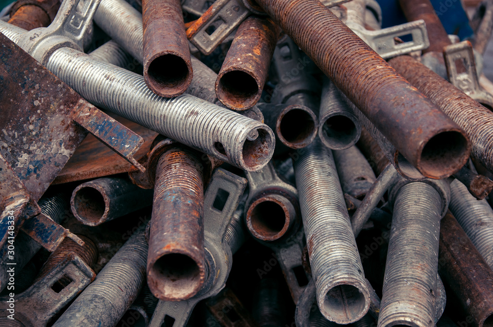 Steel pipes for reinforced concrete construction. Industrial background.