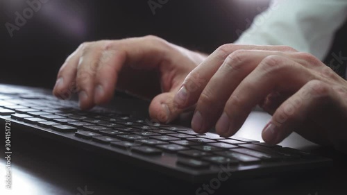 man works at the computer late at night